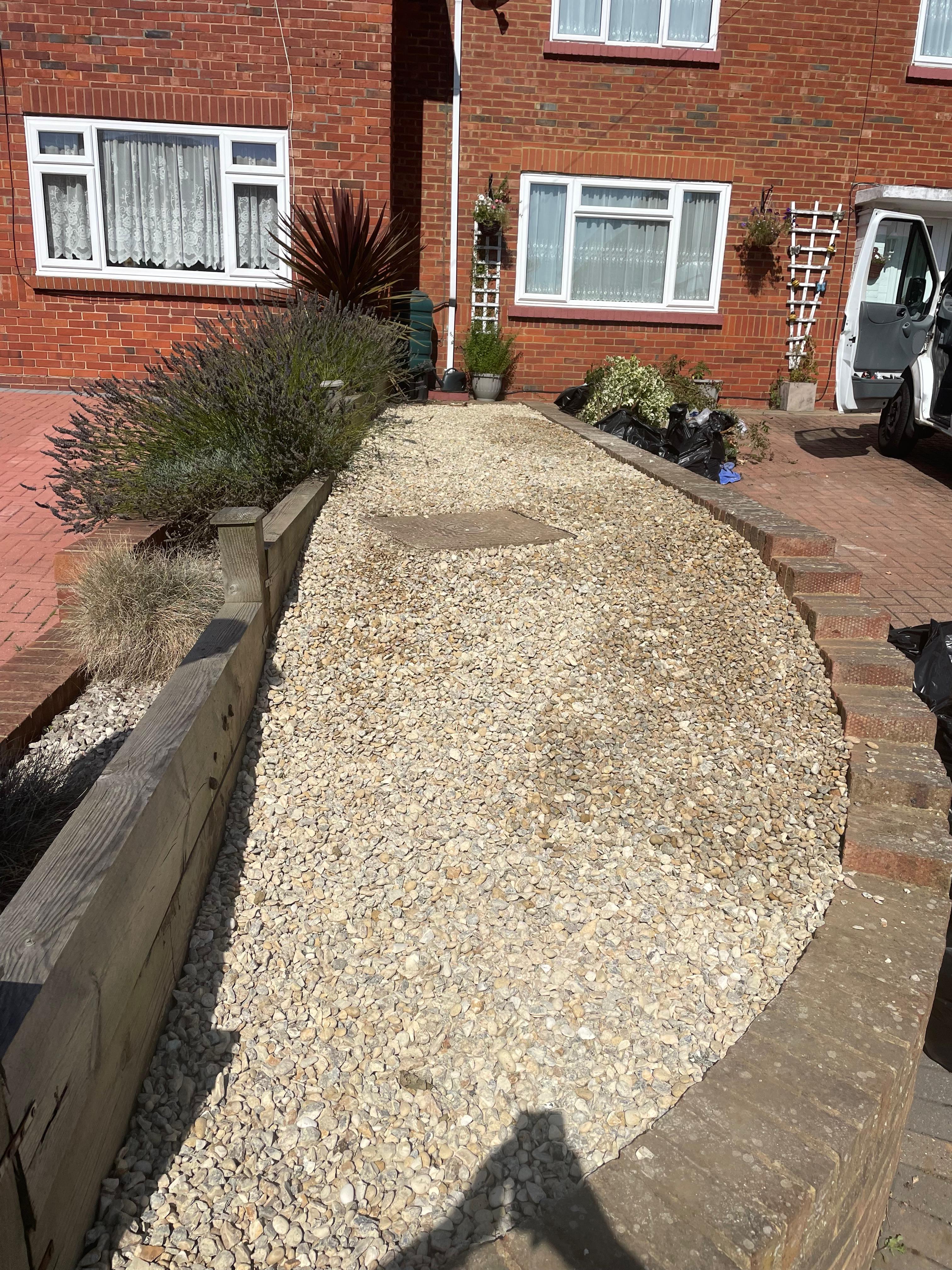 Finished gravel pathway with retained planting bed